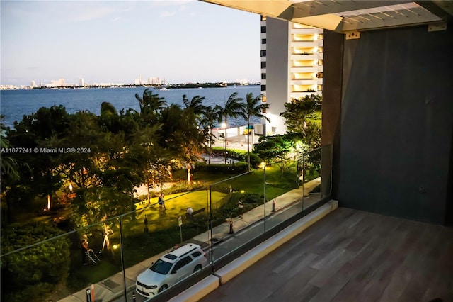 balcony featuring a water view