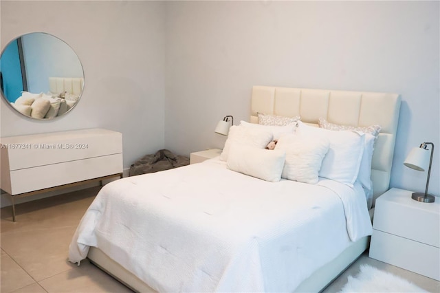 bedroom featuring light tile patterned flooring