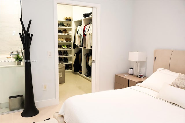 bedroom featuring a closet and light colored carpet