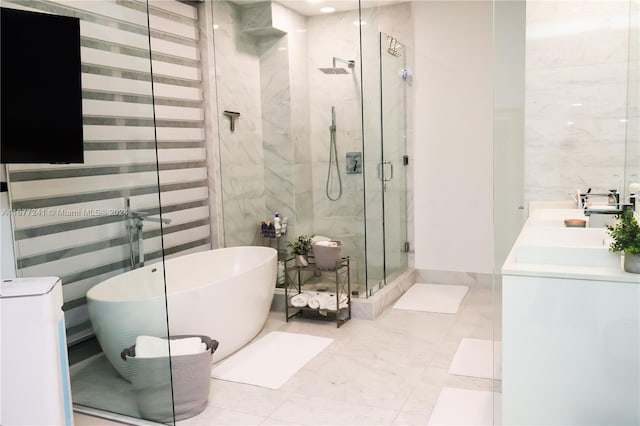 bathroom featuring vanity, tile walls, and shower with separate bathtub