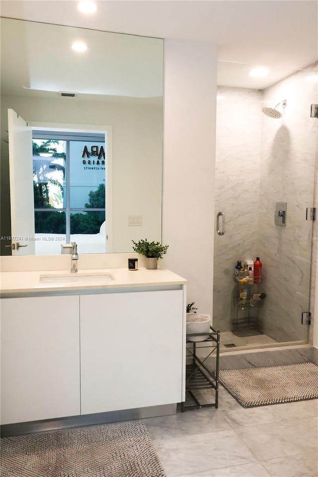 bathroom featuring vanity and walk in shower