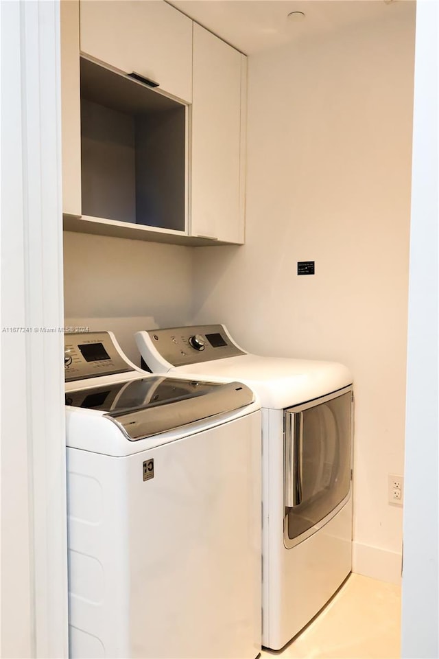 laundry room with separate washer and dryer