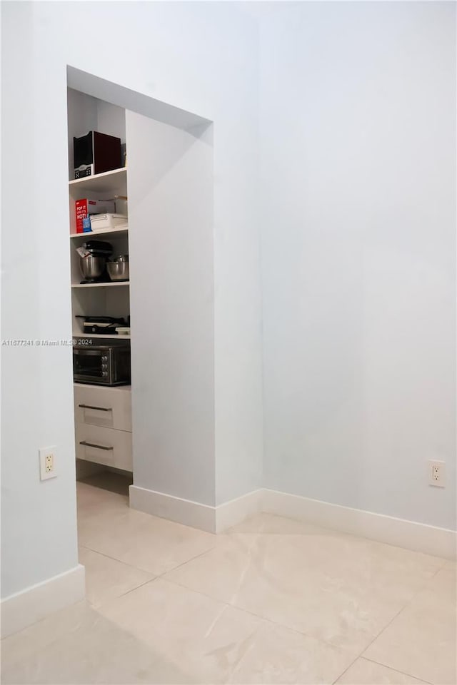 interior space with light tile patterned floors