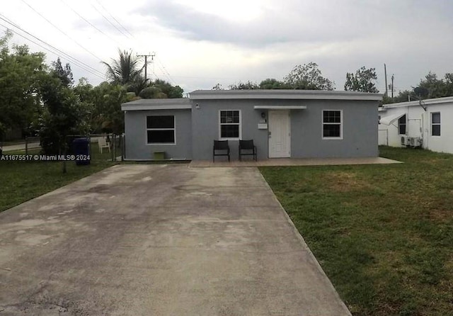 ranch-style house with a front yard