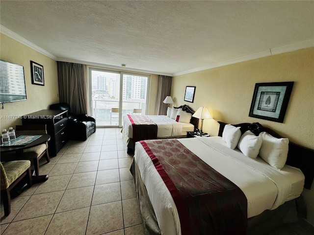 bedroom featuring ornamental molding, a textured ceiling, and light tile patterned floors