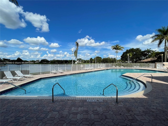 view of pool featuring a patio