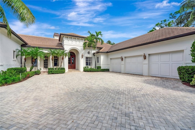 mediterranean / spanish-style home featuring a garage