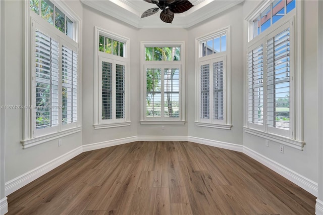 unfurnished sunroom featuring ceiling fan