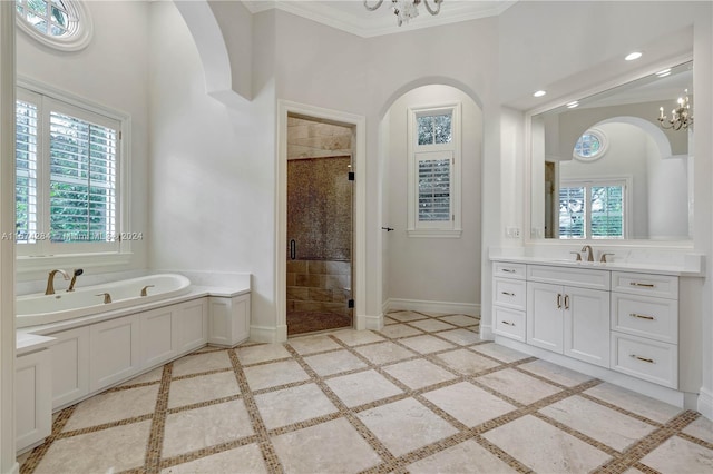 bathroom featuring vanity, crown molding, plus walk in shower, and an inviting chandelier