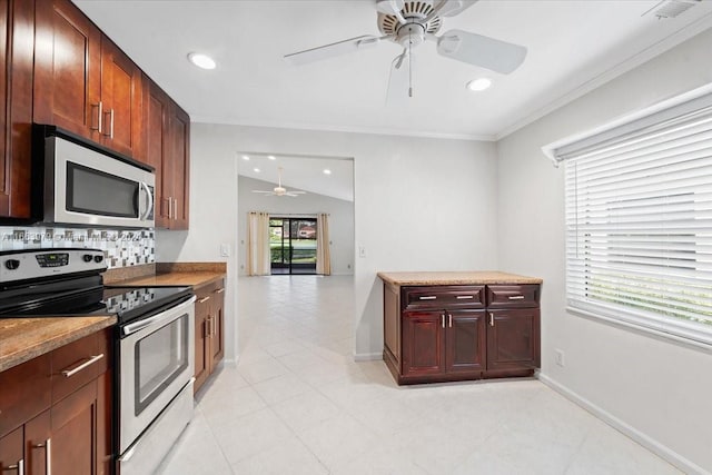 kitchen featuring ceiling fan, stainless steel appliances, tasteful backsplash, crown molding, and lofted ceiling