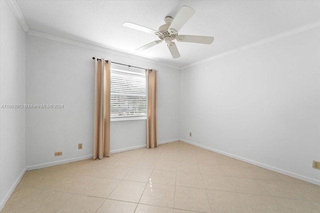 empty room with ceiling fan, light tile patterned flooring, and ornamental molding