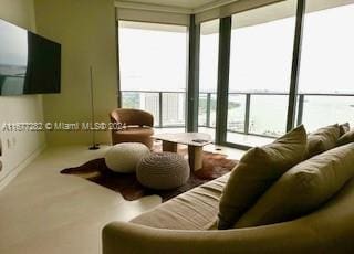 living room featuring carpet flooring and a wealth of natural light