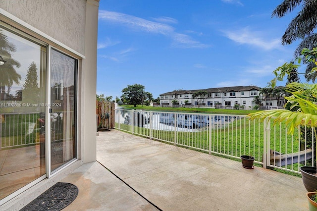 view of patio with a water view