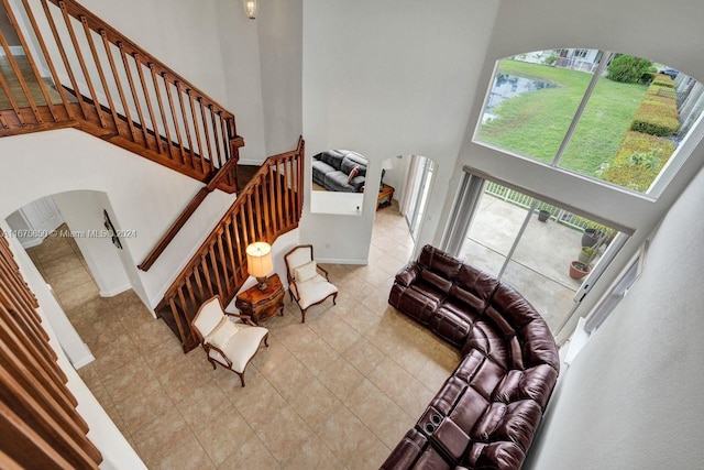 living room featuring a high ceiling