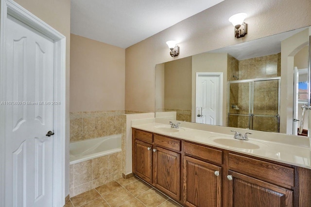 bathroom with vanity, tile patterned floors, and independent shower and bath