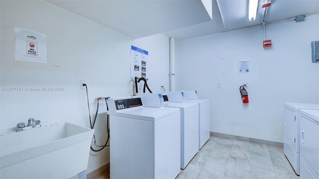 laundry area featuring sink and washing machine and dryer