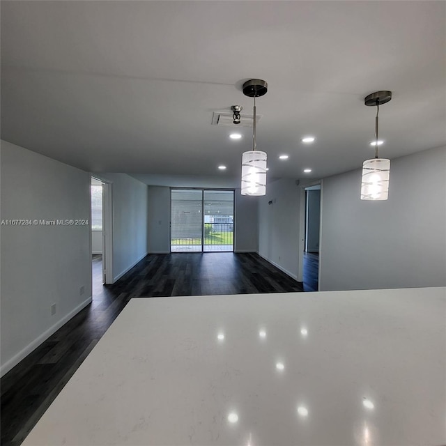 kitchen featuring hanging light fixtures and dark hardwood / wood-style flooring