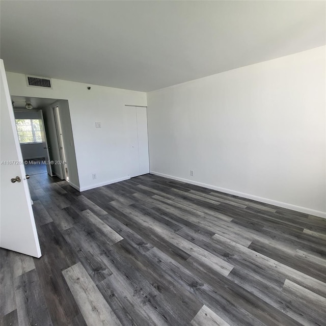 empty room featuring dark hardwood / wood-style floors