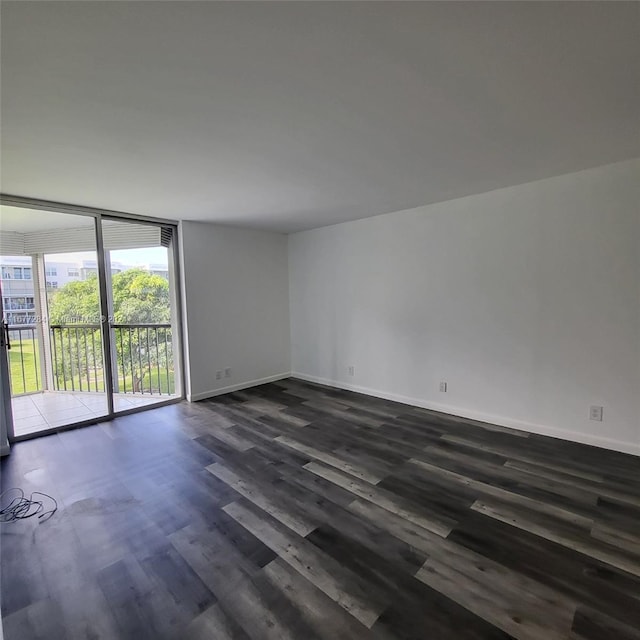 spare room with dark wood-type flooring