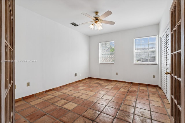 unfurnished room with ceiling fan