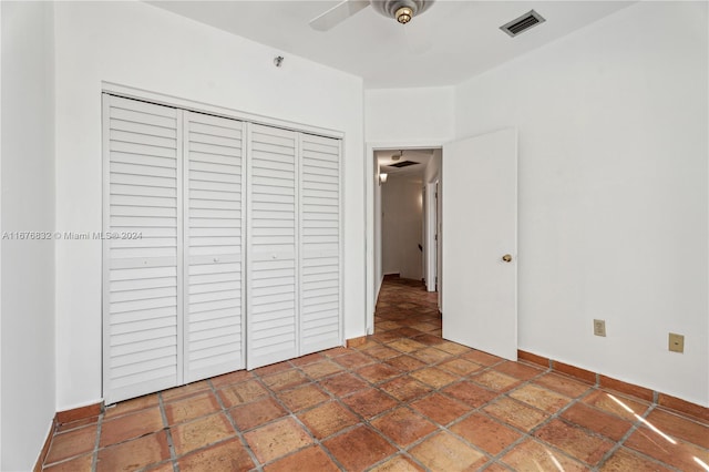 unfurnished bedroom featuring a closet and ceiling fan