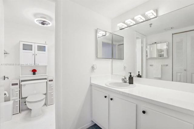 bathroom with toilet and vanity