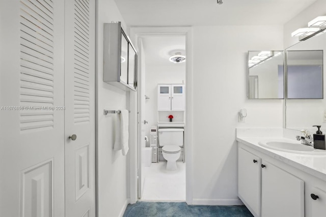 bathroom featuring vanity and toilet