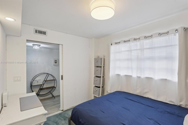 bedroom with wood-type flooring