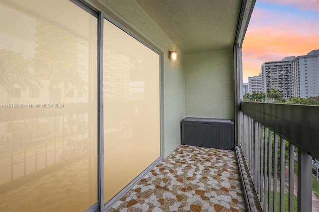 view of balcony at dusk