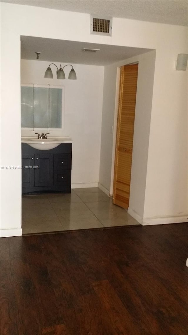 661 NE 195th St Unit 215, Miami, FL 33179 - bathroom with vanity and wood finished floors