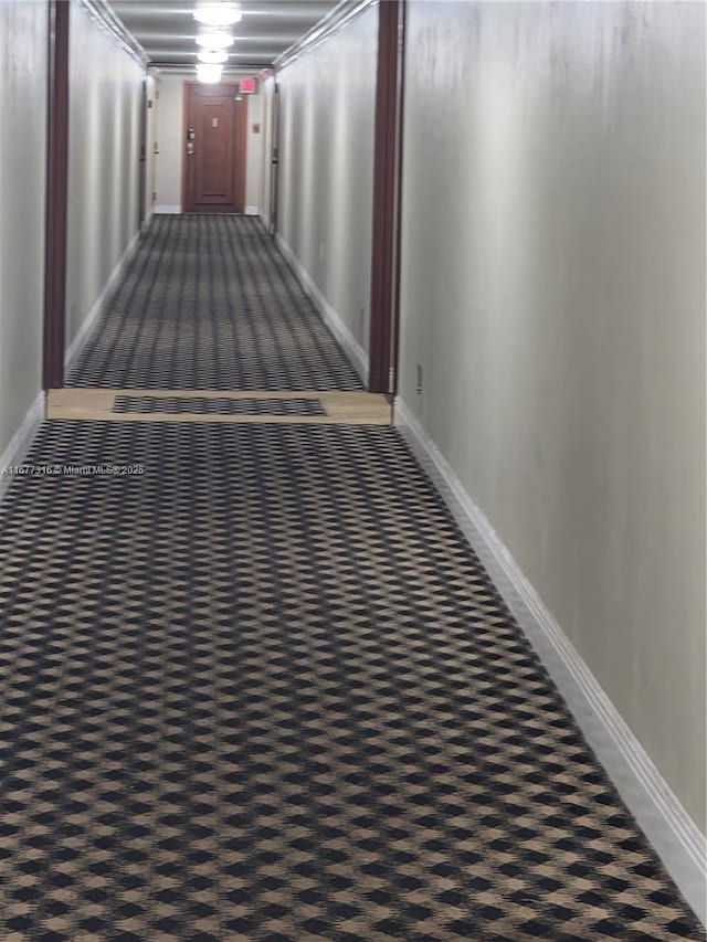 661 NE 195th St Unit 215, Miami, FL 33179 - hallway featuring carpet and baseboards