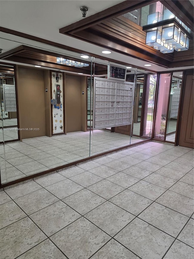 661 NE 195th St Unit 215, Miami, FL 33179 - interior space featuring mail area, fire sprinkler in ceiling, and tile patterned flooring