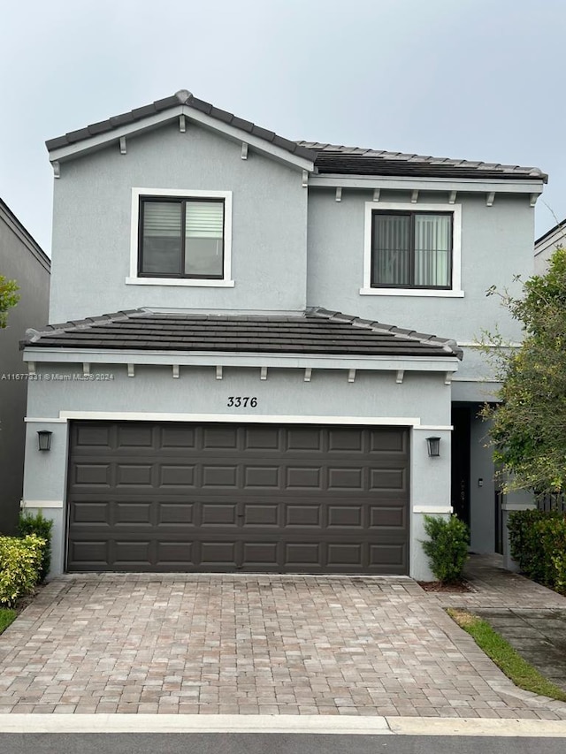 front facade with a garage