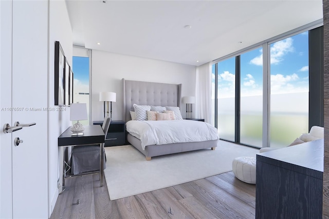 9501 Collins Ave Unit Th1, Surfside, FL 33154 - bedroom with wood finished floors, floor to ceiling windows, and access to outside