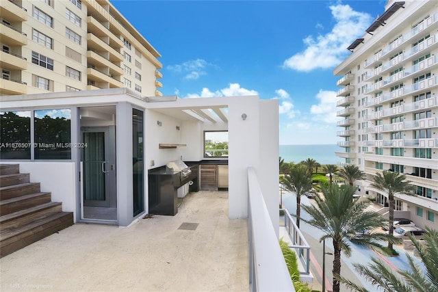9501 Collins Ave Unit Th1, Surfside, FL 33154 - view of patio featuring area for grilling, a grill, and a water view