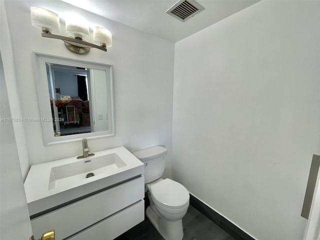 bathroom with vanity and toilet