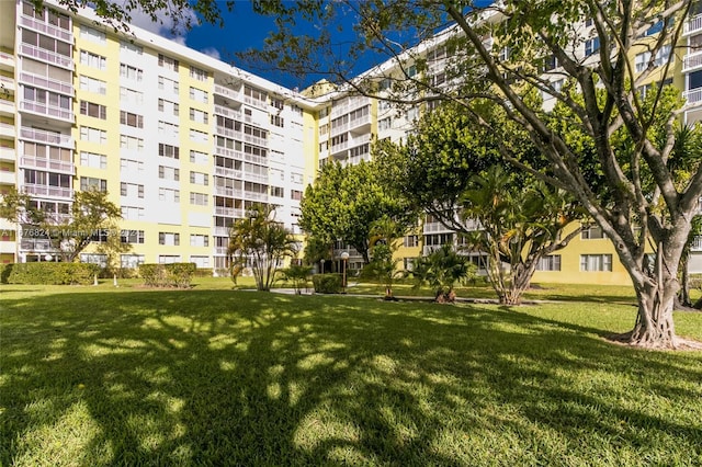 surrounding community featuring a lawn