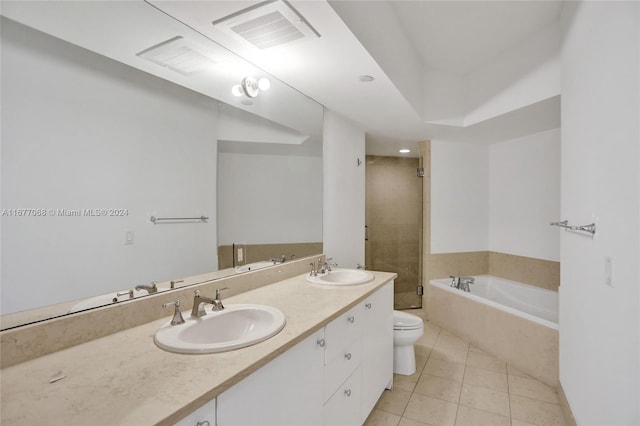 full bathroom featuring toilet, plus walk in shower, vanity, and tile patterned flooring