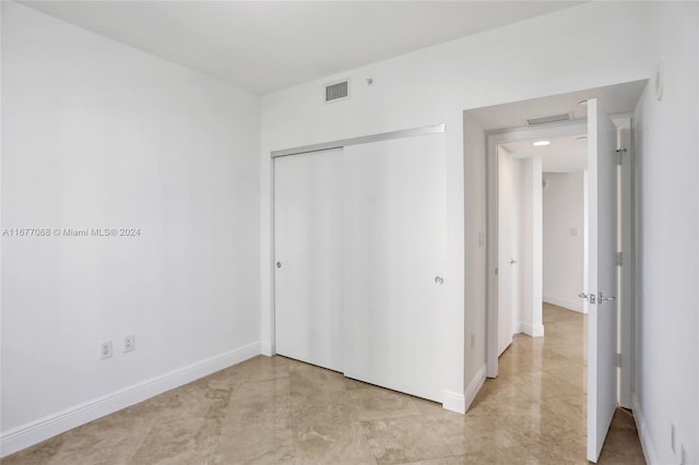 unfurnished bedroom featuring a closet