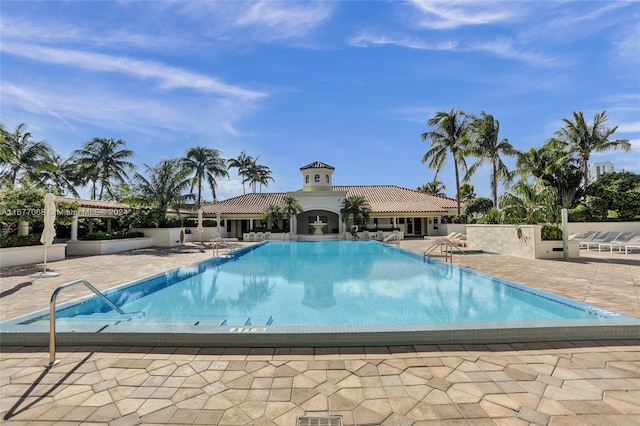 view of swimming pool with a patio