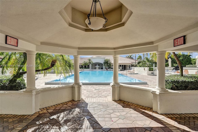 view of swimming pool featuring a patio area