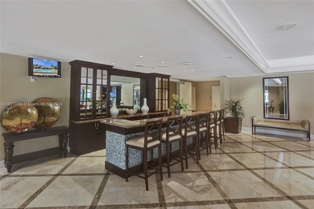 bar featuring french doors, crown molding, and dark brown cabinetry