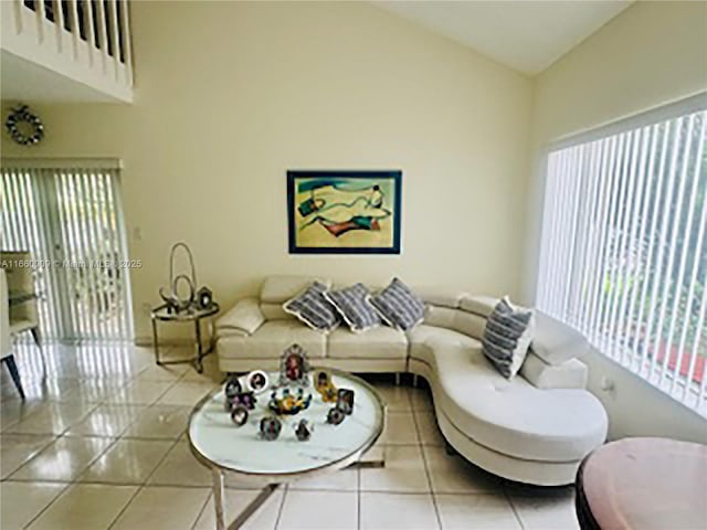 tiled living room with lofted ceiling