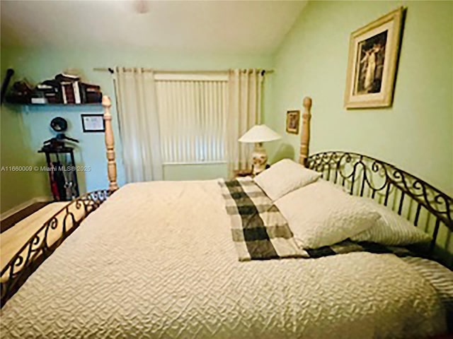 bedroom featuring lofted ceiling