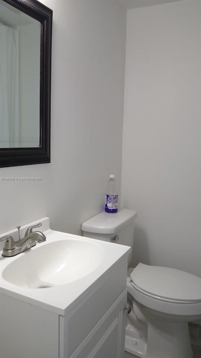 bathroom with vanity and toilet