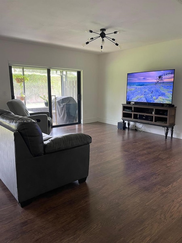 living room featuring dark hardwood / wood-style flooring and a wealth of natural light