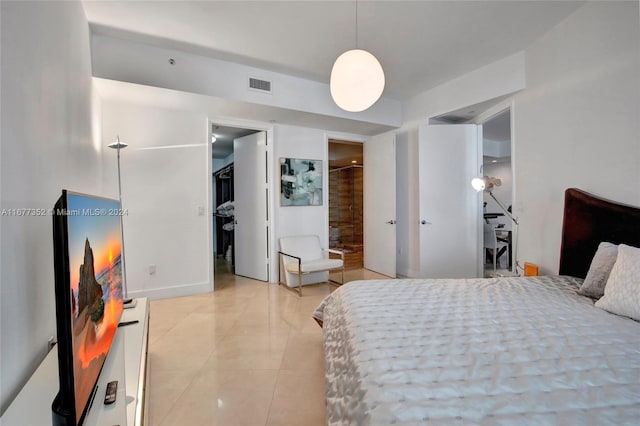 bedroom featuring light tile patterned flooring