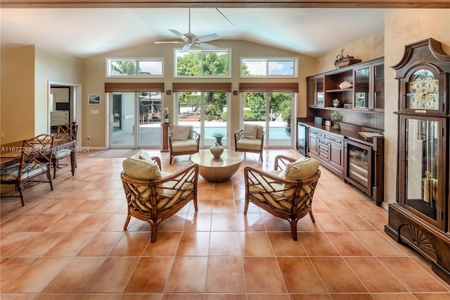 living room featuring wine cooler, lofted ceiling, ceiling fan, and plenty of natural light