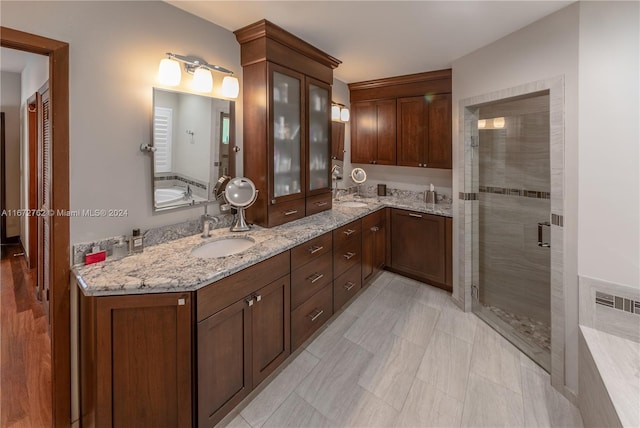 bathroom with vanity and plus walk in shower