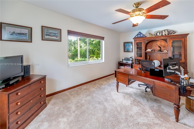 home office featuring light colored carpet and ceiling fan